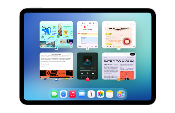 橫向放置的 iPad 螢幕上顯示日曆和音樂等多款 app，六個視窗並排展開，分成兩行均等顯示